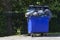 Blue wheeled garbage can