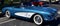 Blue and white 1958 Chevy Corvette with white wall tires