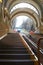 A blue and white cable funicular rises on rails along the slope. Funicular tram, side view. Station Kyiv, Ukraine