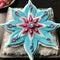 a blue and white decorated cookie