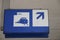 Blue and white direction sign to platforms for the trains