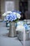 Blue and White Flower Arrangements in Silver Pewter Pitchers
