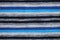 Blue white gray black colored knitting textile texture.