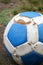 Blue and white leather soccer ball