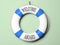 Blue and white life buoy