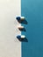 Blue and white pills on blue background