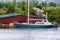 Blue and white sailboat docked on the Willamette River in Oregon