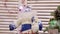 Blue-and-white Santa Claus doll with thick beard and hat,sits on fireplace