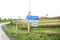 Blue and white sign to mark the start of the urban area in Oud Verlaat in the Netherlands.