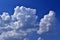 Blue and white storm Cumulus clouds before bad weather