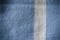 Blue and white striped material background or texture