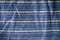 Blue and white striped material background or texture
