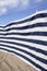 Blue and white striped windbreak at the beach