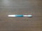 Blue and white toothbrush