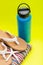 Blue Wide Mouth Insulated Stainless Steel Bottle, Women`s Causal Flip Flops, Colorful Beach Towel and Starfish on yellow