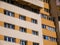 Blue windows on newly restored concrete tower apartment  buiding