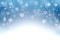 Blue winter background with snowflakes and bokeh. Christmas nigh