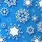 Blue winter background with white beautiful snowflakes
