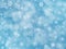 Blue winter boke background with snowflakes