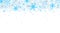 Blue winter seamless background with flying snowflakes