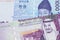 A blue won note from South Korea with a five riyal note from Saudi Arabia