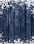 Blue Wooden christmas background with blurred white snowflakes,