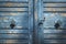 Blue wooden door close-up. Aged blue door. Shriveled wood door