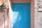 Blue wooden door of a maldivian house