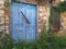 Blue Wooden Doors on Old Stone Greek Village House