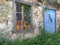 Blue Wooden Doors on Old Stone Greek Village House