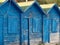 Blue wooden fisher houses in Olhos de Agua in Portugal