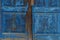 Blue wooden texture from old worn boards on the door