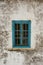 A blue wooden traditional turkish window - closed - shut - white wall as a background with blank space for text