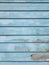 Blue wooden wall with color peeling