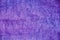 Blue wool sheep texture, fur close-up. Background sheepskin violet. Texture of purple colored sheep wool, rug