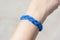 Blue wrist band made with cord