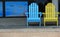 Blue and yellow Adirondack chairs for visitors to sit on