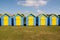 Blue and yellow beach huts