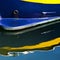 Blue and Yellow Boat with Reflection