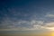 Blue yellow cloudscape background. evening clouds motion