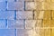 blue-yellow hailstone superimposed on stacked paving slabs sprinkled with sand