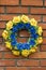 Blue yellow memory wreath.