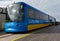 A blue and yellow passenger tram travels along Southport Pier October 2011