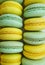 blue and yellow pastel macarons without cream. colored food background