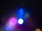 Blue, yellow and purple bokeh. Perfect abstract overlay footage. Trendy neon colors festive sparkling defocused lights