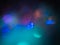 Blue, yellow and purple bokeh. Perfect abstract overlay footage. Trendy neon colors festive sparkling defocused lights