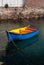 Blue and yellow rowing boat