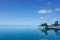 Blue and yellow seaplane on the turquoise maldivian lagoon