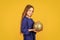 Blue and yellow. Shimmering glitter. Prepare decorations in advance. Girl hold golden ball decorations. Decorative
