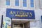 A blue and yellow sign on tops of the store Antiques on the Square at the Marietta Square in Marietta Georgia